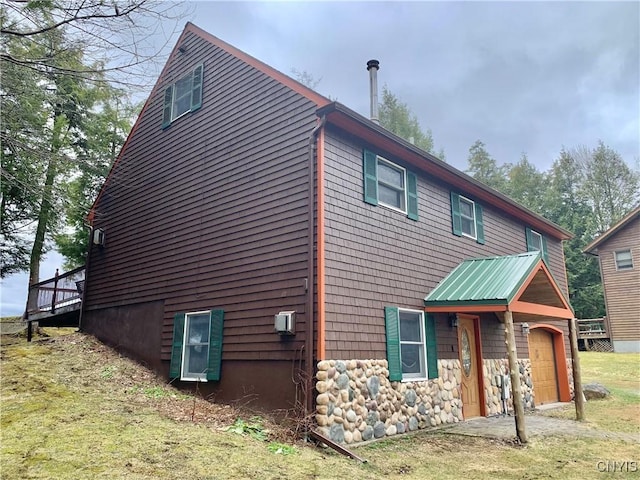 5048 State Route 28, Webb, NY 13420 - view of home's exterior with a garage
