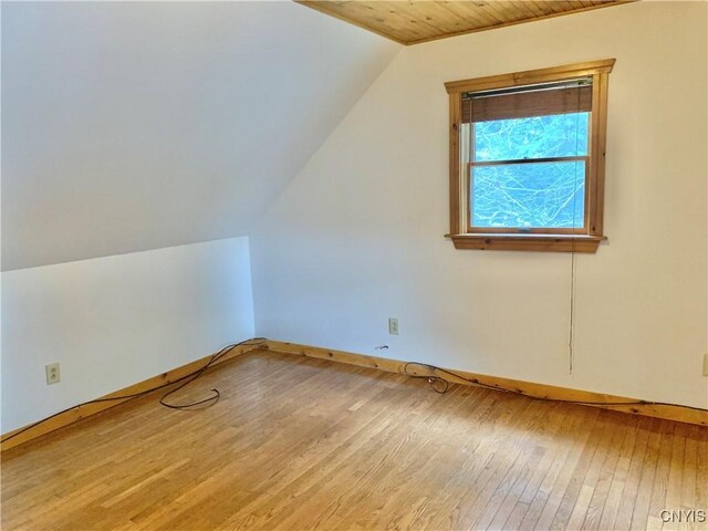 5048 State Route 28, Webb, NY 13420 - bonus room featuring vaulted ceiling, baseboards, and hardwood / wood-style floors