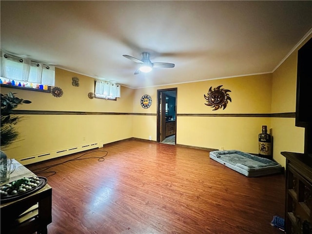 121 E William St, Bath, NY 14810 - interior space with wood finished floors, baseboards, baseboard heating, ceiling fan, and ornamental molding