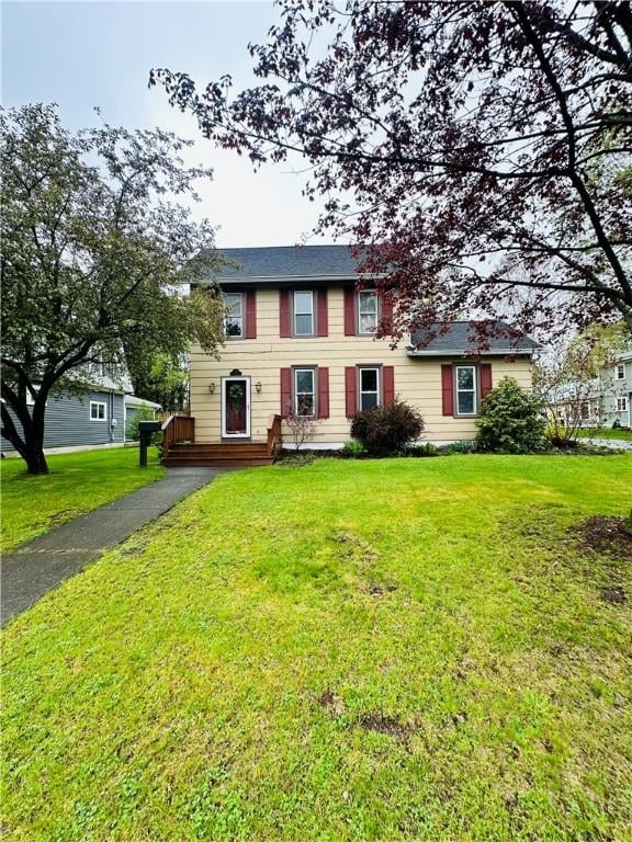 121 E William St, Bath, NY 14810 - colonial home featuring a front lawn