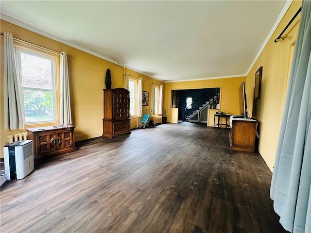 121 E William St, Bath, NY 14810 - unfurnished living room featuring baseboards, ornamental molding, stairway, and wood finished floors