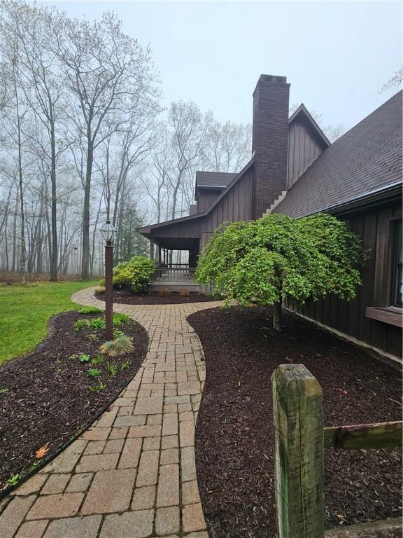 view of yard with covered porch