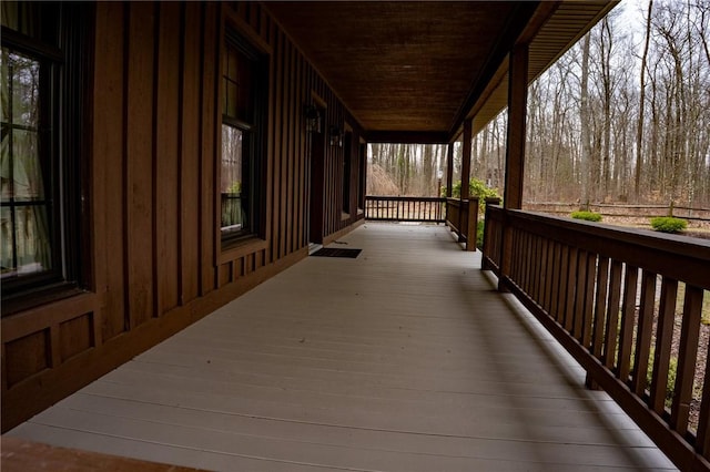 wooden terrace with a porch