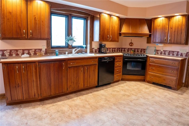 kitchen with a sink, custom exhaust hood, black appliances, and brown cabinets