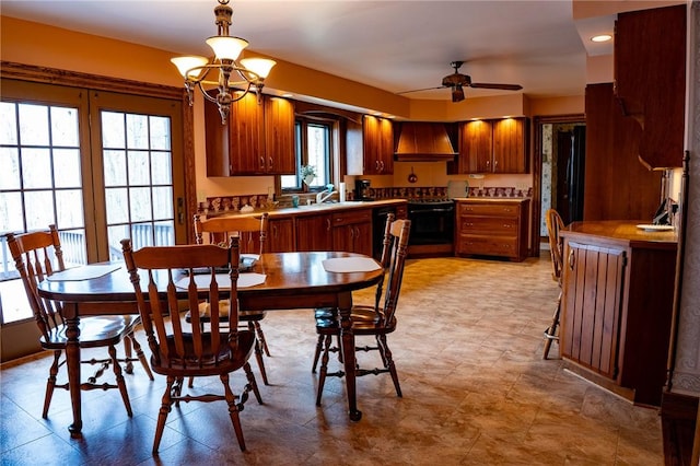 dining room with a ceiling fan and recessed lighting