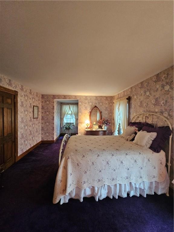 10400 Fox Ridge Rd, Corning, NY 14830 - carpeted bedroom with wallpapered walls and baseboards