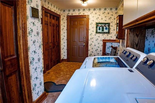 laundry room featuring washer and clothes dryer, laundry area, and wallpapered walls