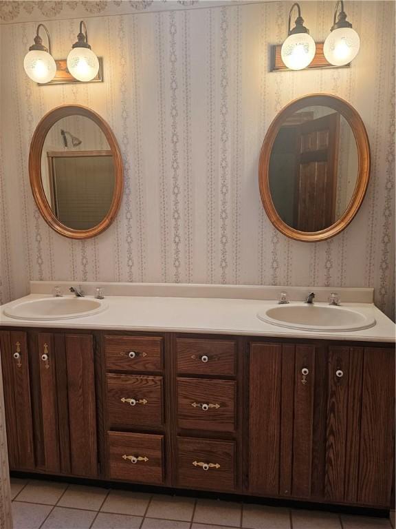 10400 Fox Ridge Rd, Corning, NY 14830 - bathroom featuring wallpapered walls, double vanity, and tile patterned flooring
