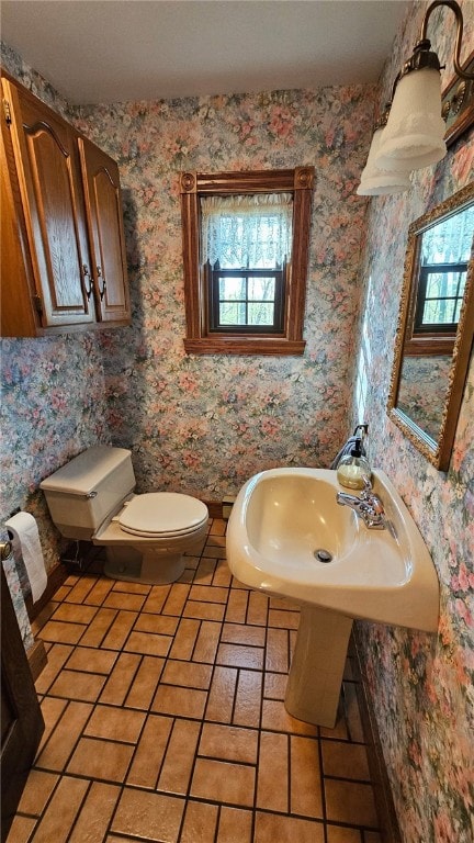 10400 Fox Ridge Rd, Corning, NY 14830 - half bathroom featuring toilet, wallpapered walls, and a sink