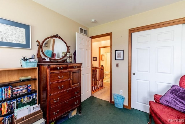 bedroom with visible vents and dark carpet