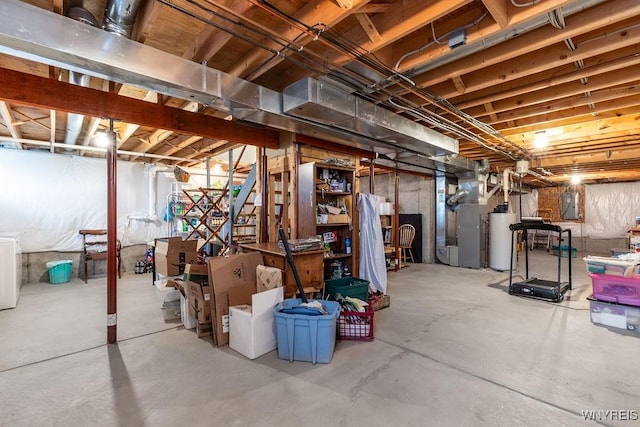unfinished basement with heating unit and gas water heater