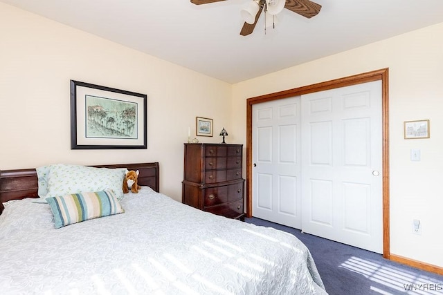 carpeted bedroom with a ceiling fan and a closet