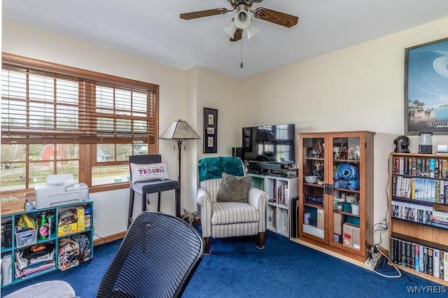 living area with ceiling fan and carpet floors