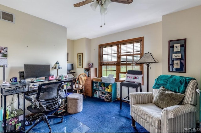 office space with carpet, a ceiling fan, and visible vents