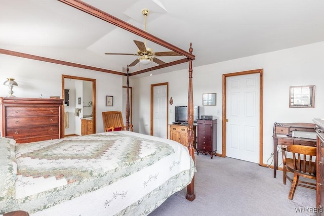 bedroom featuring light colored carpet, connected bathroom, a ceiling fan, and lofted ceiling