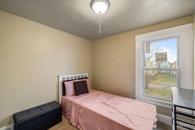 carpeted bedroom featuring visible vents