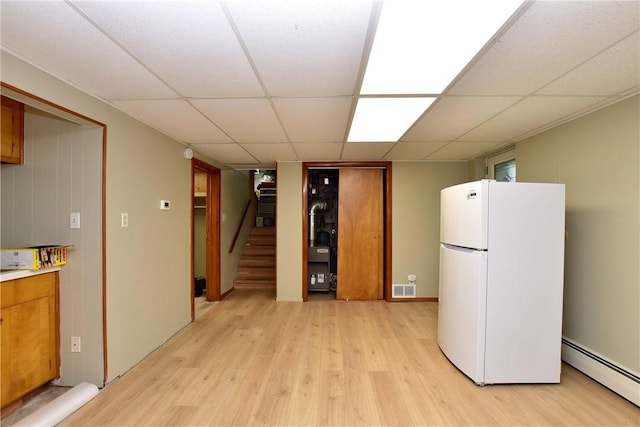 726 Robinson Hill Rd, Union, NY 13790 - kitchen with freestanding refrigerator, light wood-style flooring, a baseboard radiator, and a drop ceiling