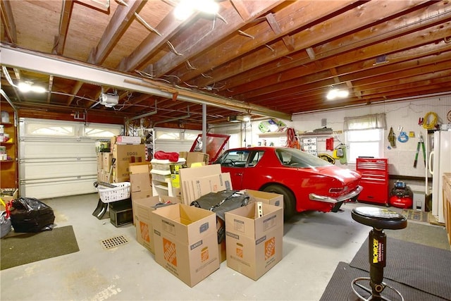 726 Robinson Hill Rd, Union, NY 13790 - garage featuring freestanding refrigerator and a garage door opener