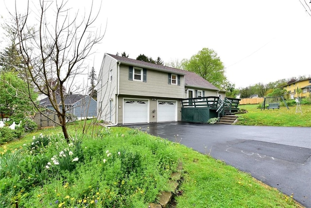 726 Robinson Hill Rd, Union, NY 13790 - view of front of house featuring a deck, aphalt driveway, and an attached garage