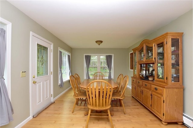 726 Robinson Hill Rd, Union, NY 13790 - dining area with light wood finished floors, baseboards, and a baseboard radiator