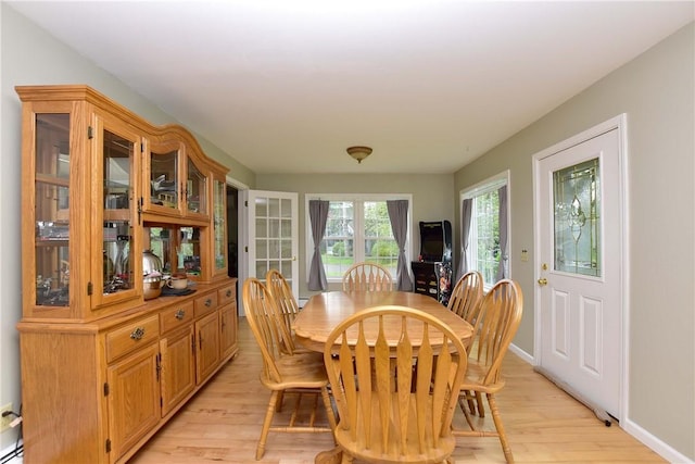 726 Robinson Hill Rd, Union, NY 13790 - dining room with baseboards, light wood-type flooring, and a baseboard heating unit