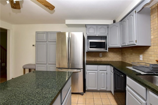 726 Robinson Hill Rd, Union, NY 13790 - kitchen featuring a ceiling fan, gray cabinetry, light tile patterned flooring, decorative backsplash, and stainless steel appliances