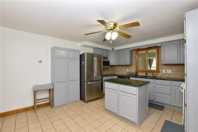 726 Robinson Hill Rd, Union, NY 13790 - kitchen with freestanding refrigerator, dark countertops, gray cabinets, and tasteful backsplash