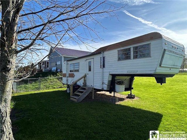 9642 S Dayton Silver Creek Rd, Villenova, NY 14062 - back of property with a yard, fence, and entry steps