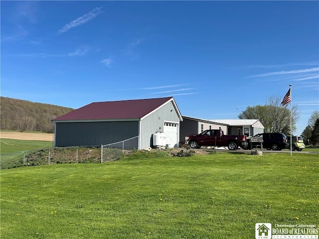 9642 S Dayton Silver Creek Rd, Villenova, NY 14062 - view of pole building featuring a yard and fence