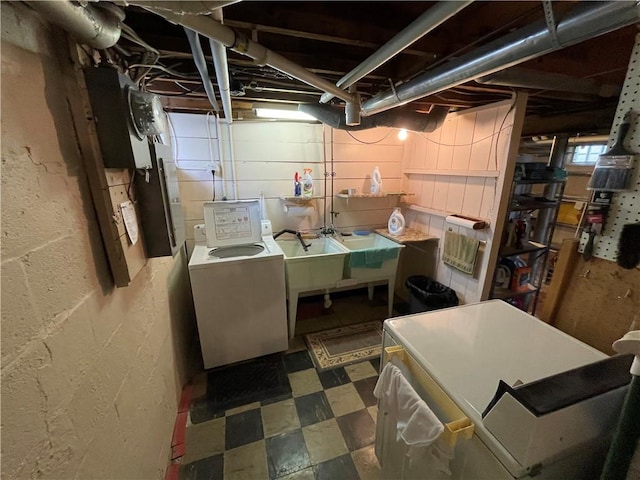 below grade area featuring washer and dryer and tile patterned floors