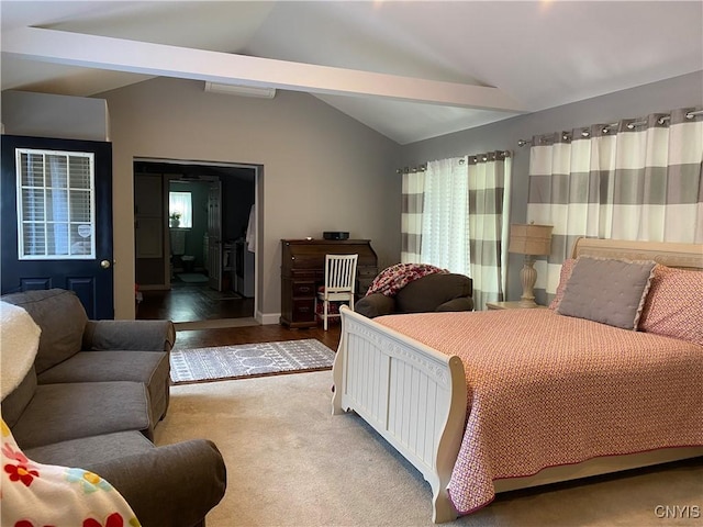 bedroom with carpet flooring, vaulted ceiling, and baseboards