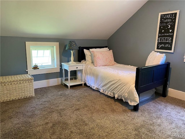 bedroom with baseboards, carpet floors, and vaulted ceiling