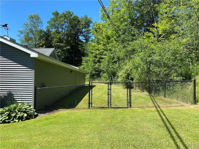view of yard featuring a gate and fence