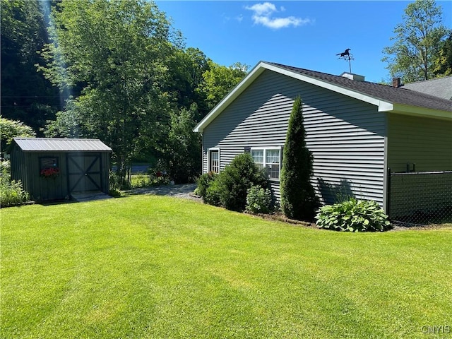 view of side of property with a storage shed, an outdoor structure, and a lawn