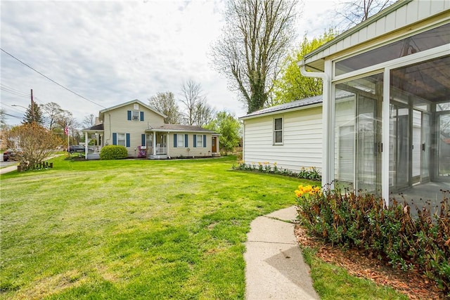 view of yard with a sunroom