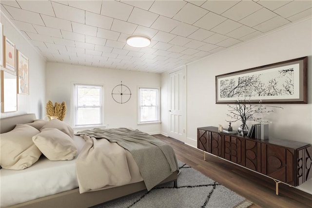 bedroom featuring wood finished floors