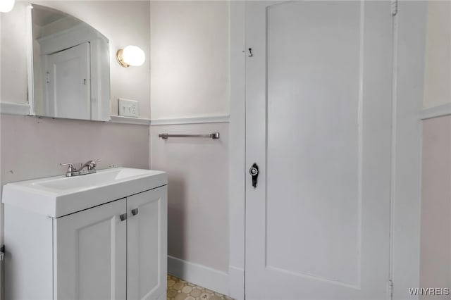 bathroom featuring vanity and baseboards