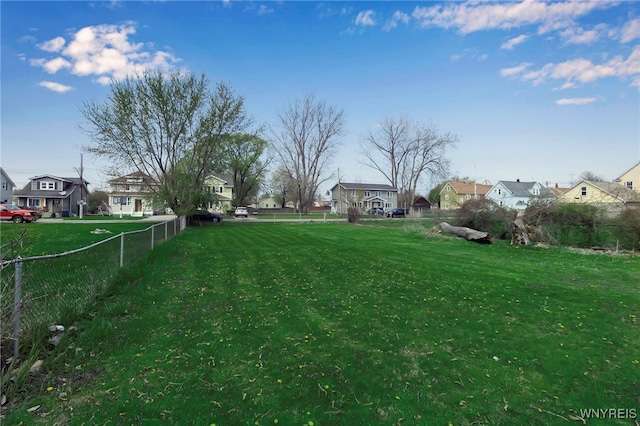 view of yard with fence and a residential view
