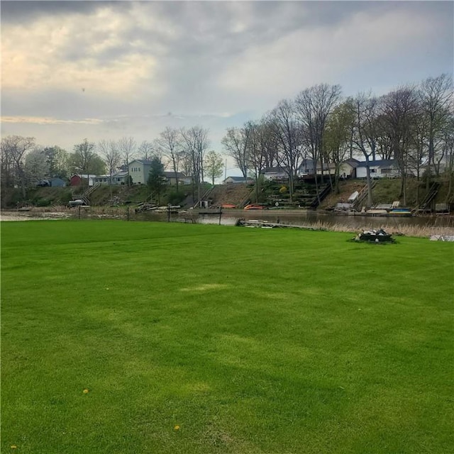 view of home's community featuring a lawn