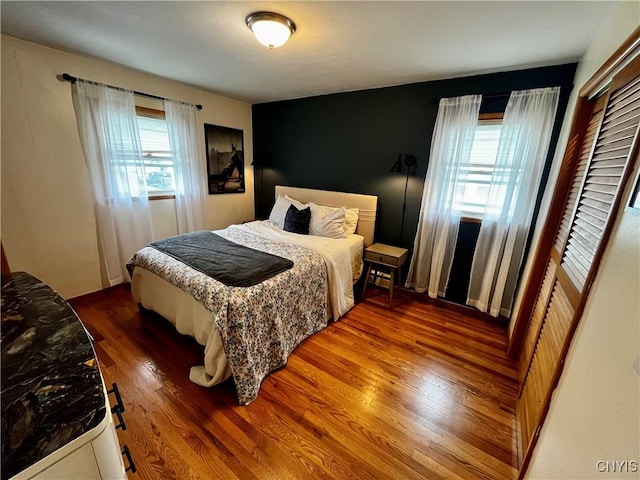 bedroom featuring wood finished floors