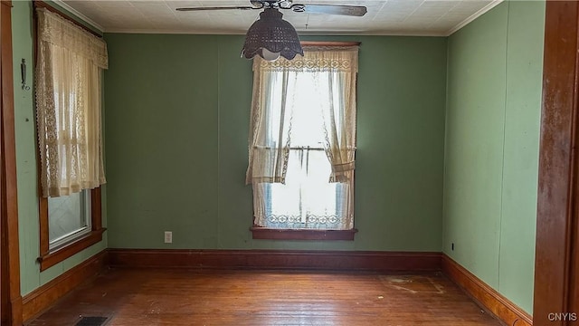 420 Main St, Russia, NY 13324 - empty room featuring baseboards, a ceiling fan, ornamental molding, and hardwood / wood-style flooring