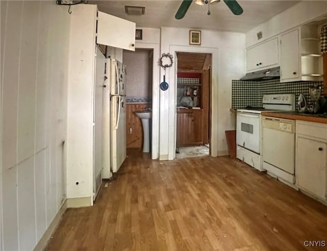 420 Main St, Russia, NY 13324 - kitchen with a ceiling fan, under cabinet range hood, white appliances, light wood finished floors, and dark countertops