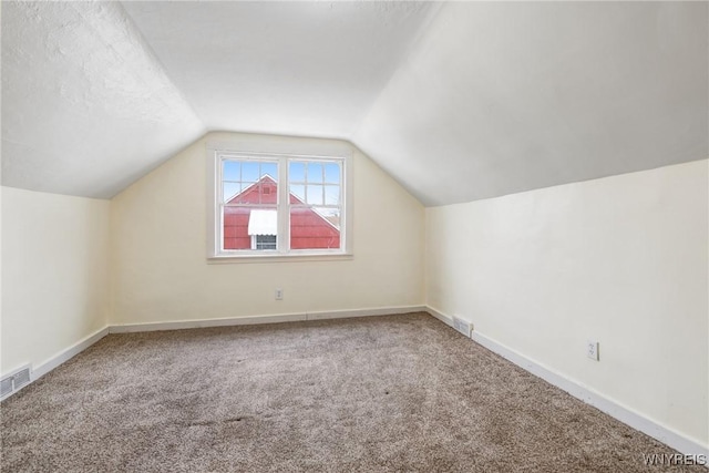 321 Eggert Rd, Cheektowaga, NY 14215 - bonus room featuring carpet flooring, vaulted ceiling, and baseboards