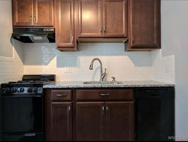 kitchen with under cabinet range hood, backsplash, a sink, and black appliances