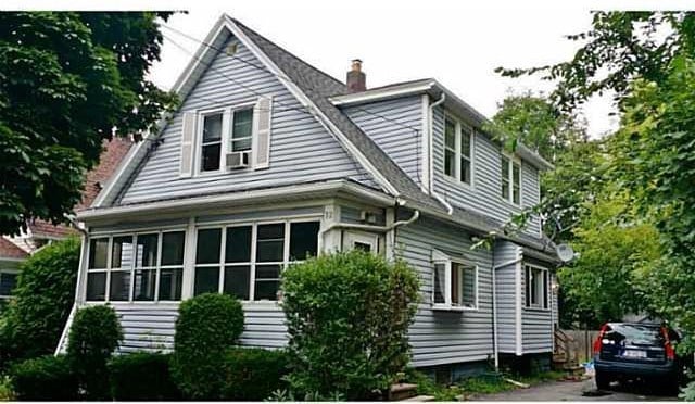 view of side of property with a chimney