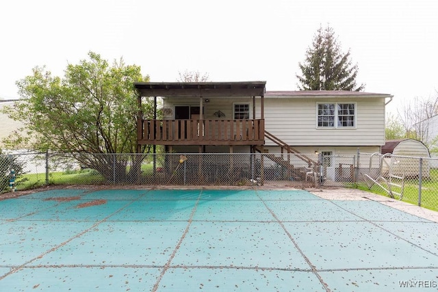 back of house with stairway, fence, and a wooden deck
