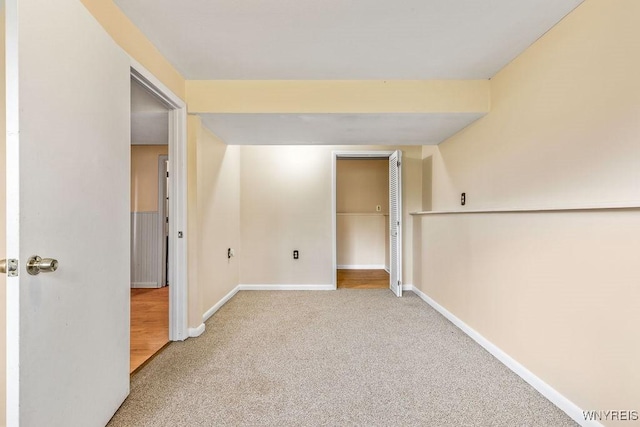 empty room with baseboards and carpet floors