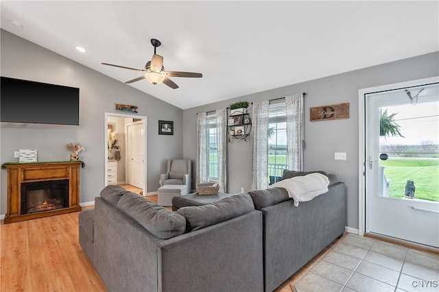26519 State Route 180, Brownville, NY 13634 - living room with a ceiling fan, a wealth of natural light, and vaulted ceiling