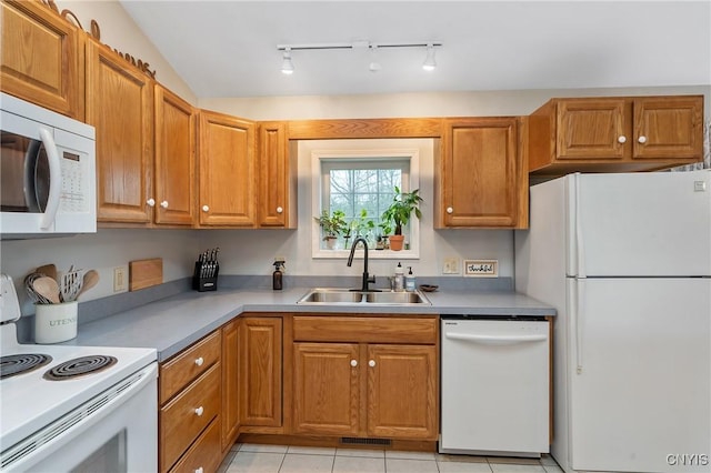 26519 State Route 180, Brownville, NY 13634 - kitchen with brown cabinets, a sink, track lighting, visible vents, and white appliances