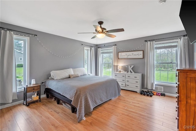 26519 State Route 180, Brownville, NY 13634 - bedroom with light wood-type flooring, visible vents, baseboards, and ceiling fan